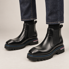 Black Lug Sole Chelsea Ankle Boot — on-foot studio view