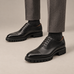 DIVINCH black glossy lug-sole cap-toe Oxford shoe on foot