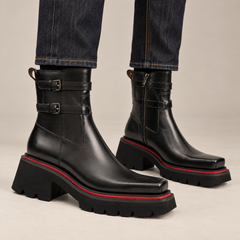 Black double-strap ankle boots on foot