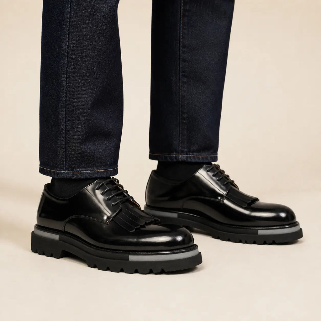 DIVINCH black polished kiltie fringe platform Derby shoes worn on foot
