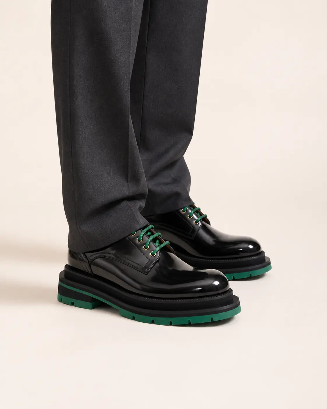 DIVINCH black green leather platform derbies on foot in warm studio