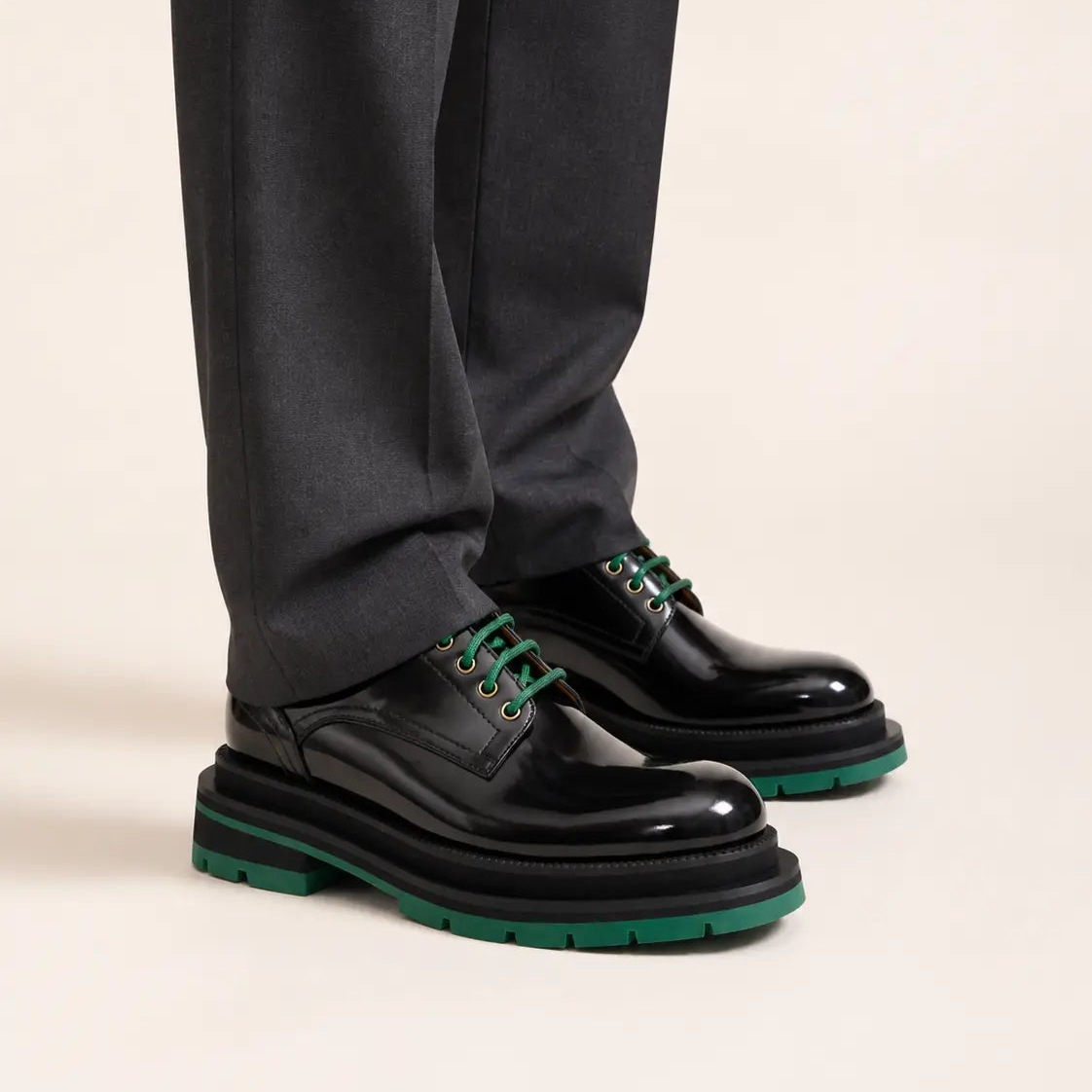 DIVINCH black green leather platform derbies on foot in warm studio