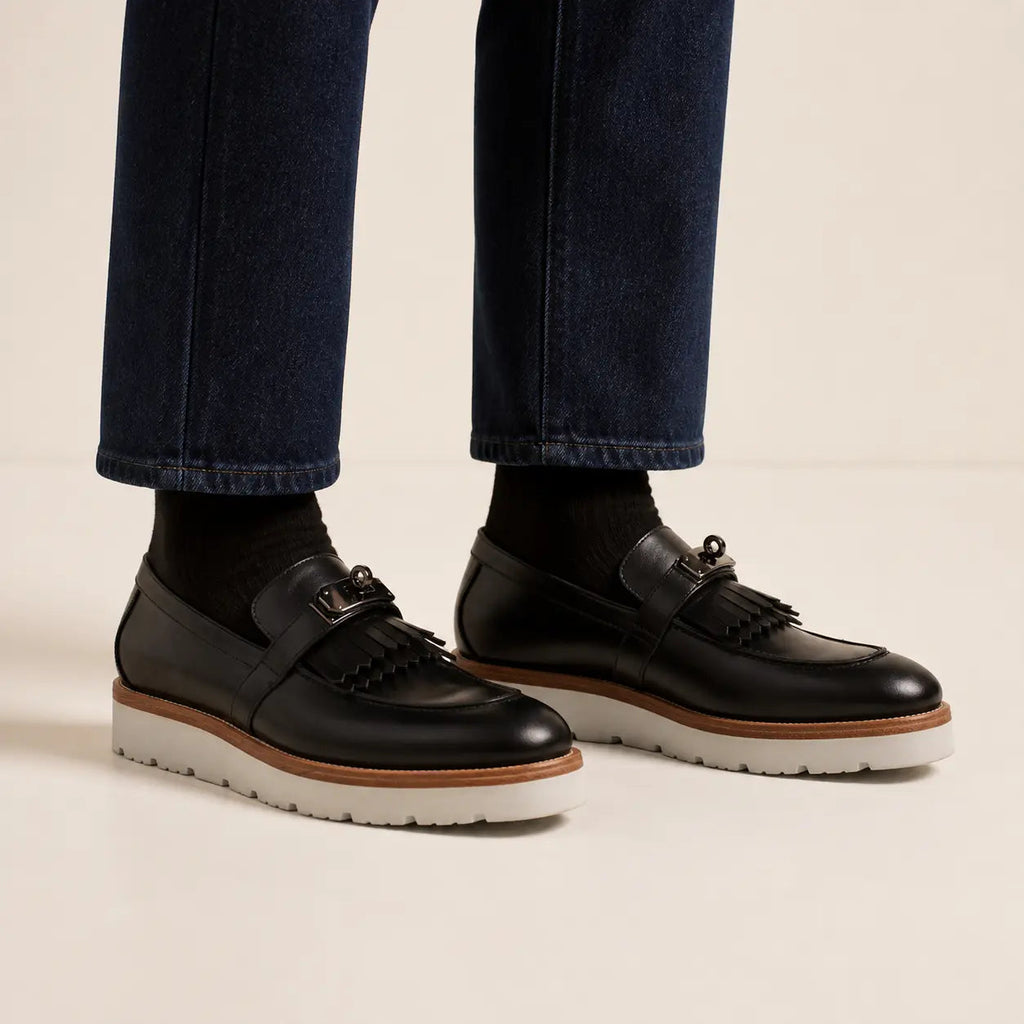 Black kiltie buckle XL sole loafers on foot