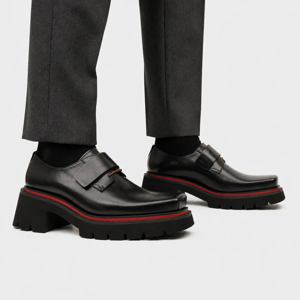 Black lug-sole strap shoes on foot