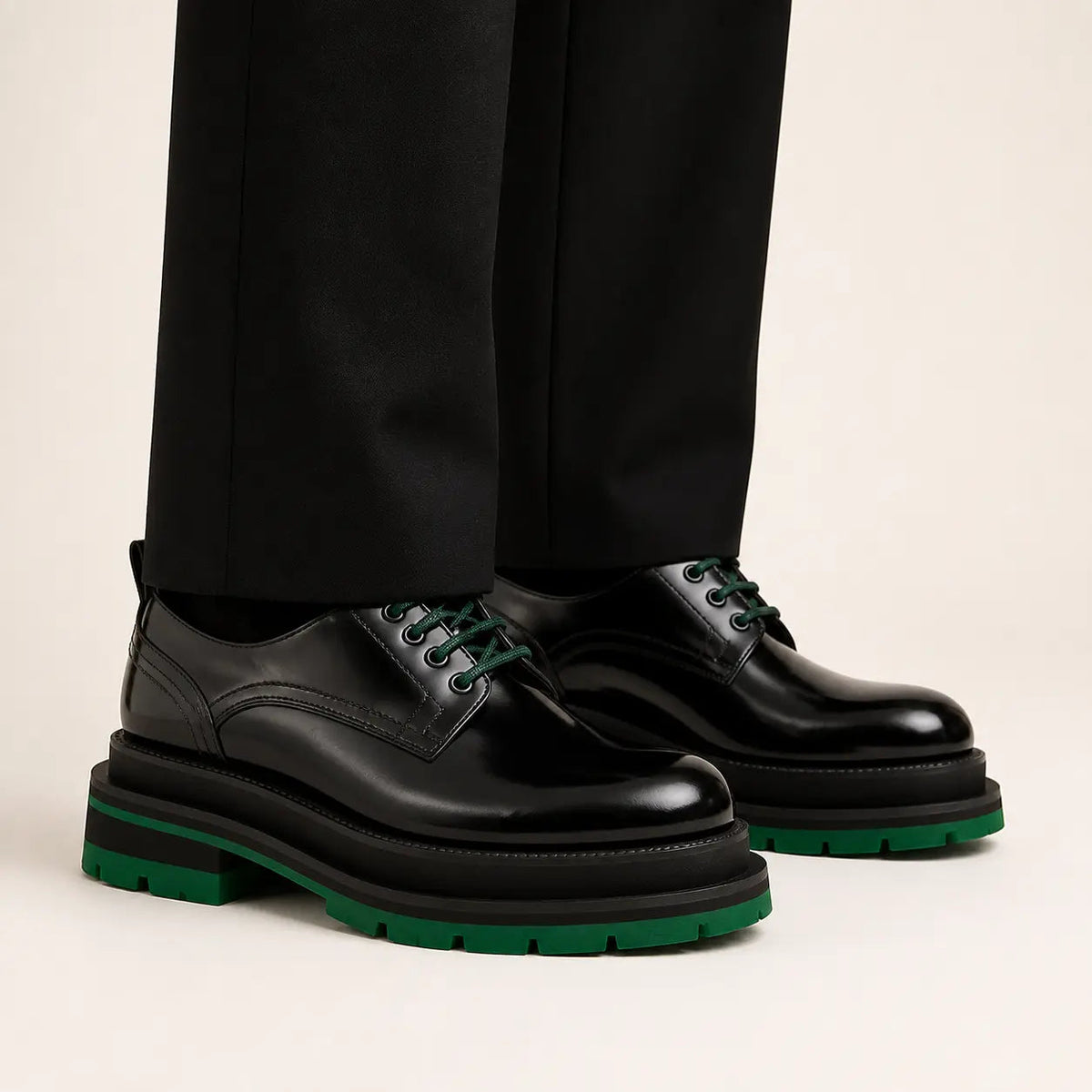 DIVINCH black patent derby shoes with green laces on foot in warm studio