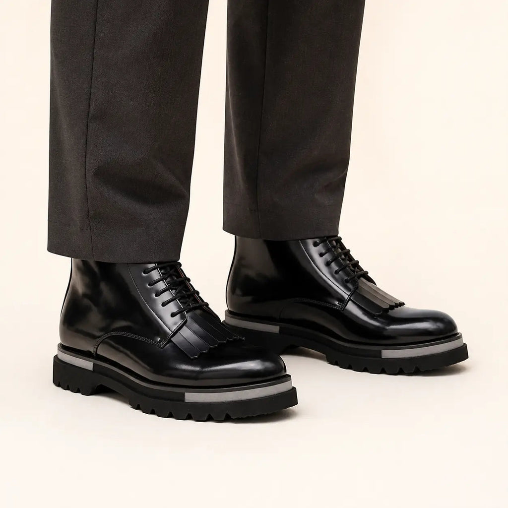 DIVINCH black patent kiltie lace up boots on foot in warm studio