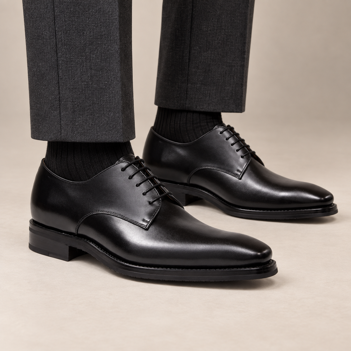 Black plain-toe Derby shoes with polished finish on model lower legs, DIVINCH D823