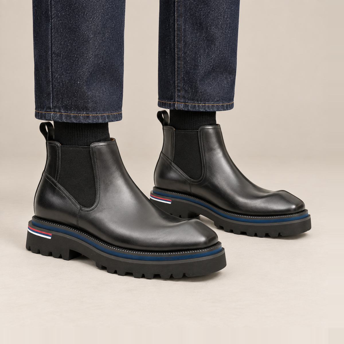 Black Square-Toe Chelsea Boots with Pull Tab — on-foot studio view
