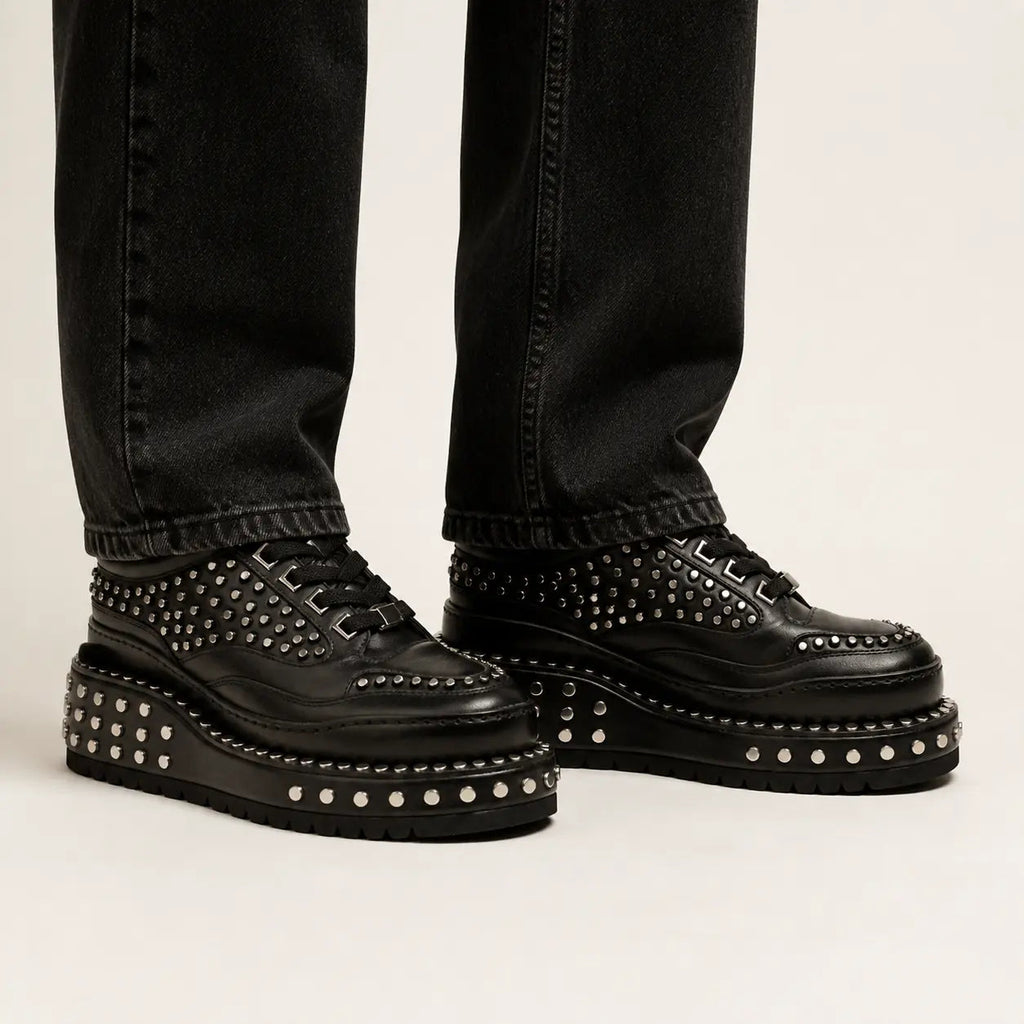 Black Heavy Studded Platform Sneaker — on-foot studio view