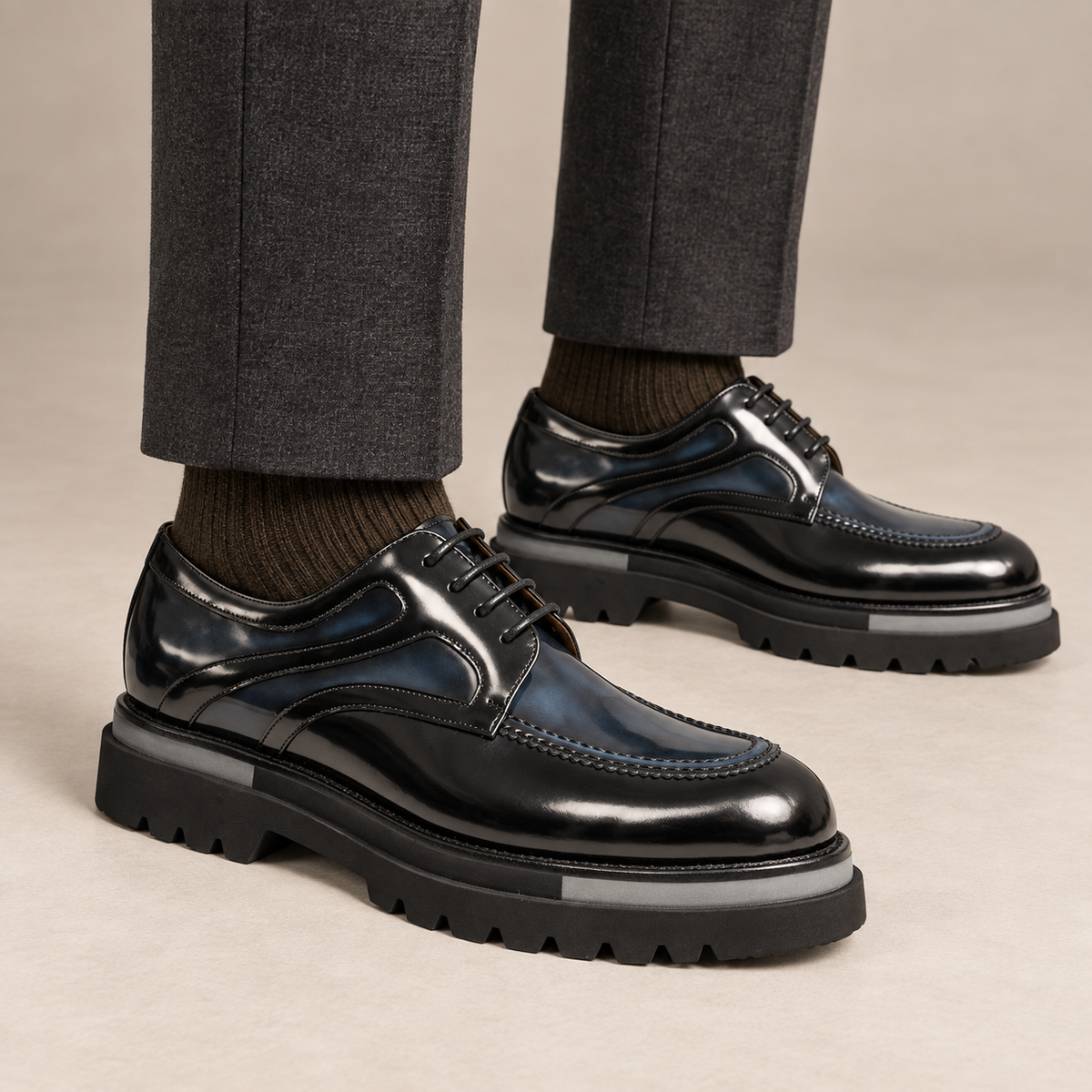 DIVINCH black and dark blue layered-panel moc-toe Derby shoes worn with tailored charcoal trousers