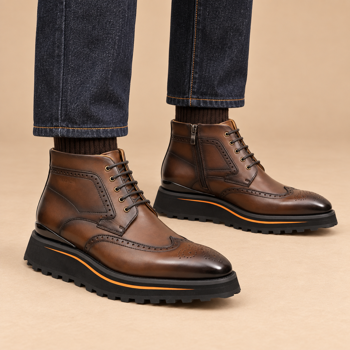 Brown wingtip lace-up ankle boots with side zipper on model