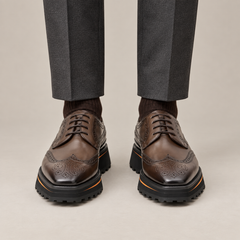 Brown Perforated Wingtip Derby Shoes with Brown-Edge Lug Sole — DIVINCH hero image, parallel stance