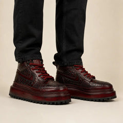 Burgundy crocodile platform boots on-foot studio photo