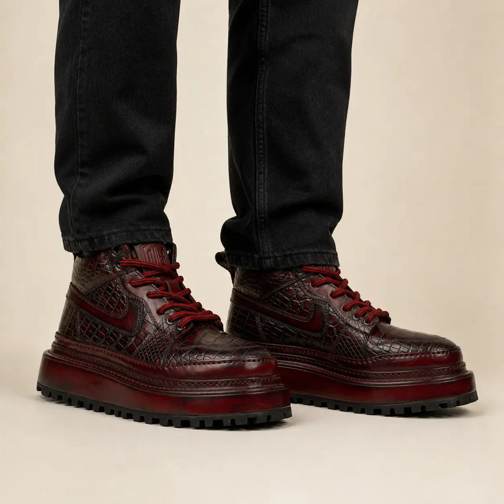 Burgundy crocodile platform boots on-foot studio photo
