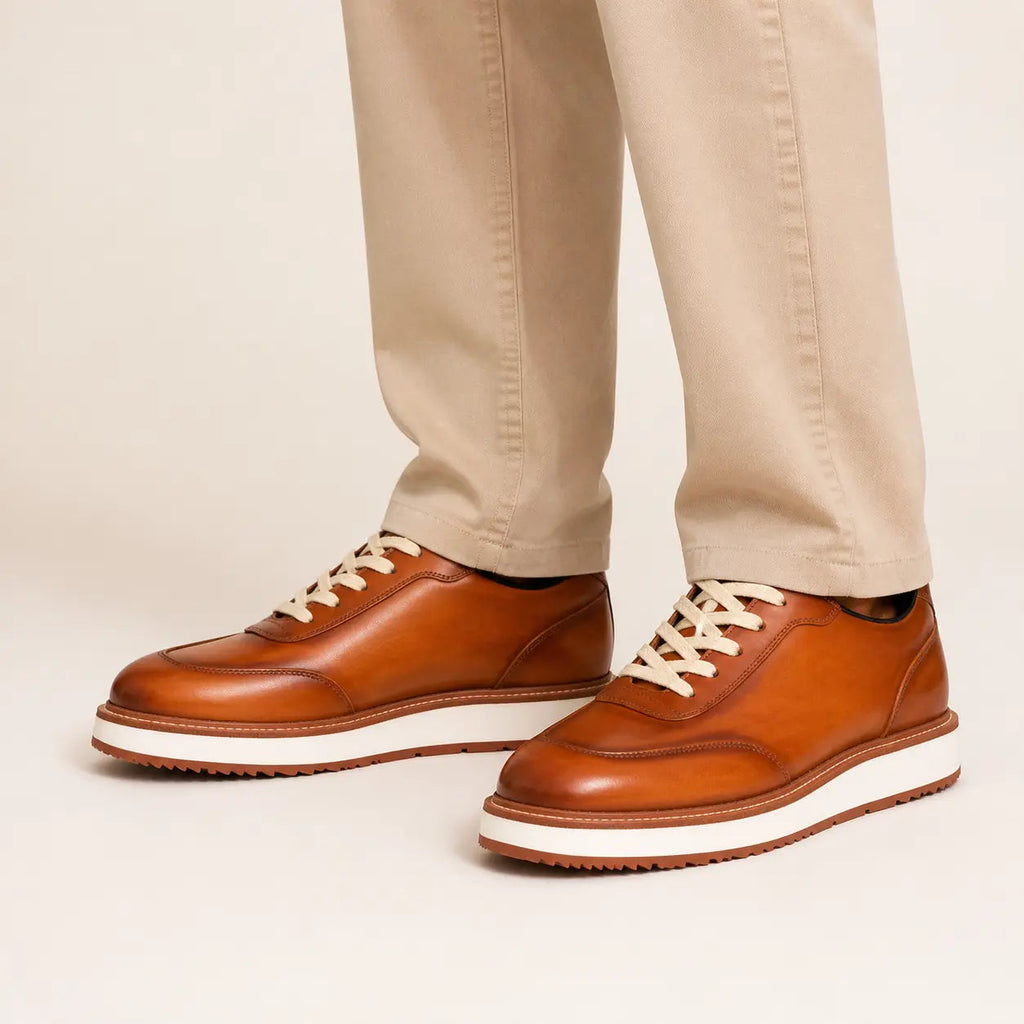 DIVINCH burnished cognac platform derby sneaker on foot in warm studio