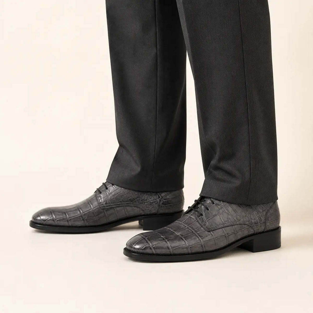 Charcoal crocodile-textured Derby shoes on foot