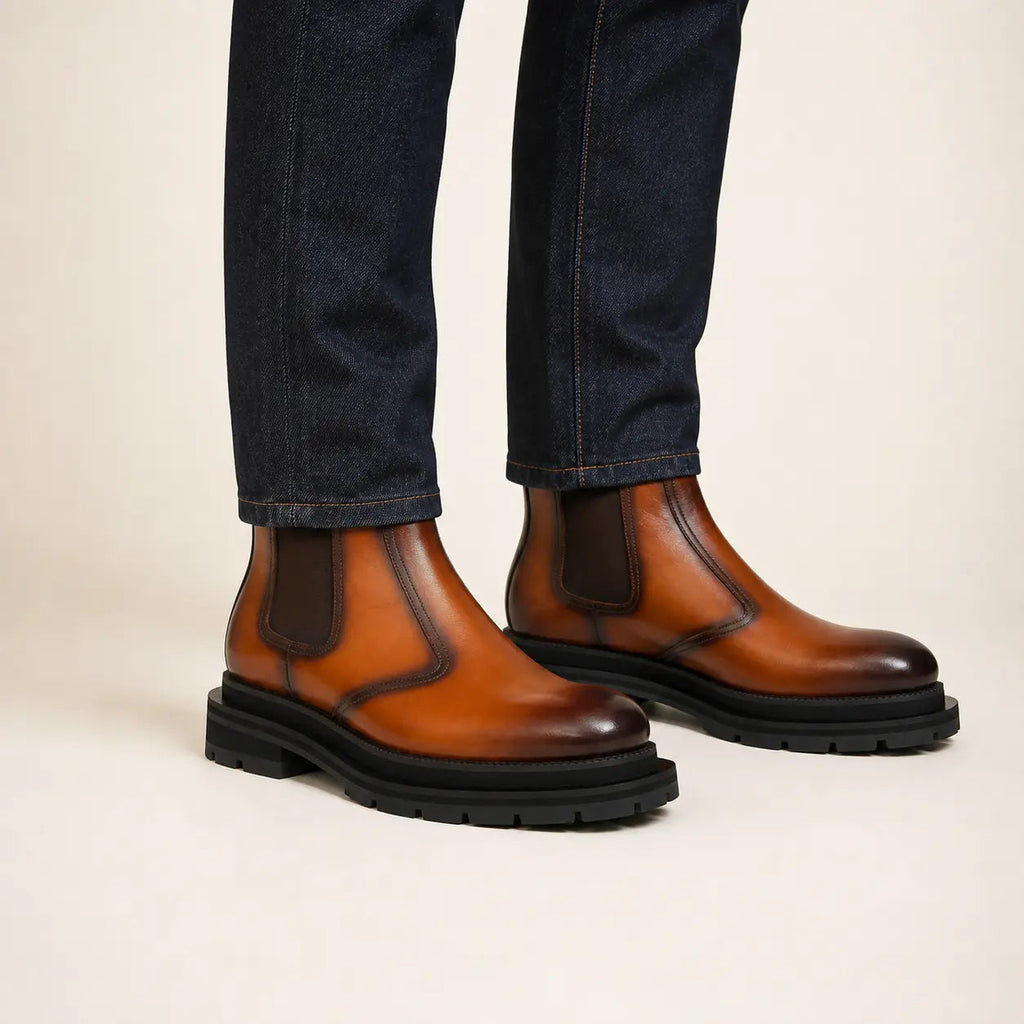 Cognac burnished Chelsea boots on-foot studio photo