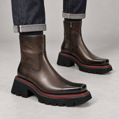 Dark brown side-zip ankle boots on foot