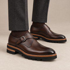 Dark brown glossy plain-toe monk-strap shoes — on-foot studio view