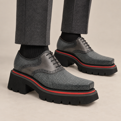 Dark gray beaded-texture Oxford shoes on foot