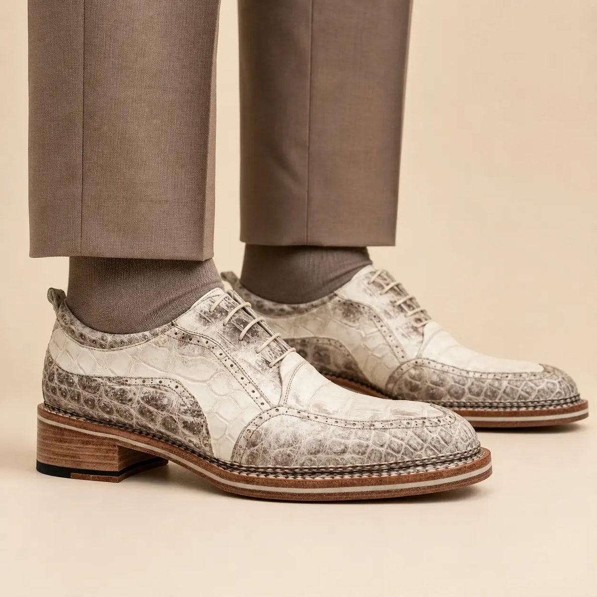 DIVINCH ivory and stone-grey embossed Oxford shoes worn on foot