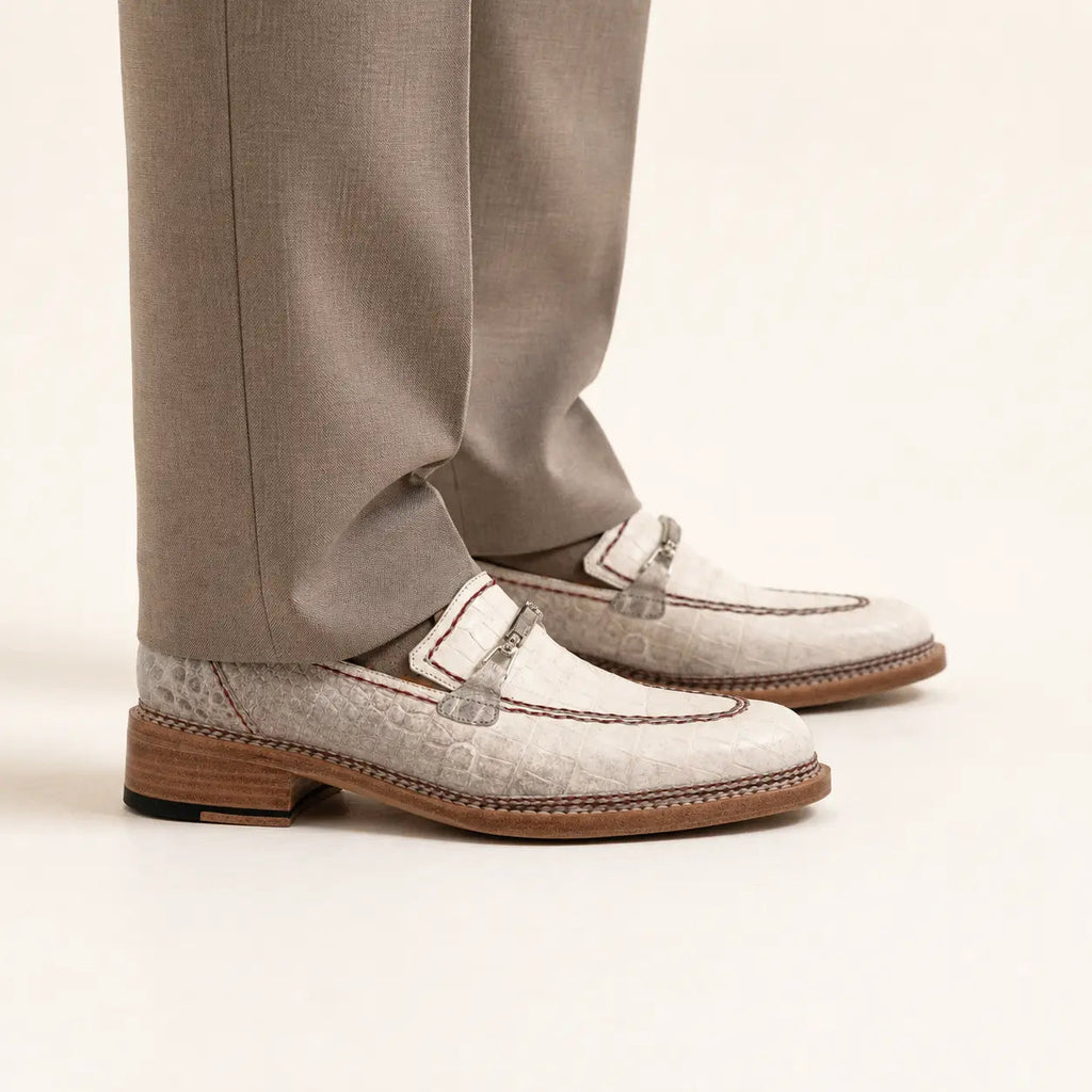 Ivory crocodile-textured loafer on foot