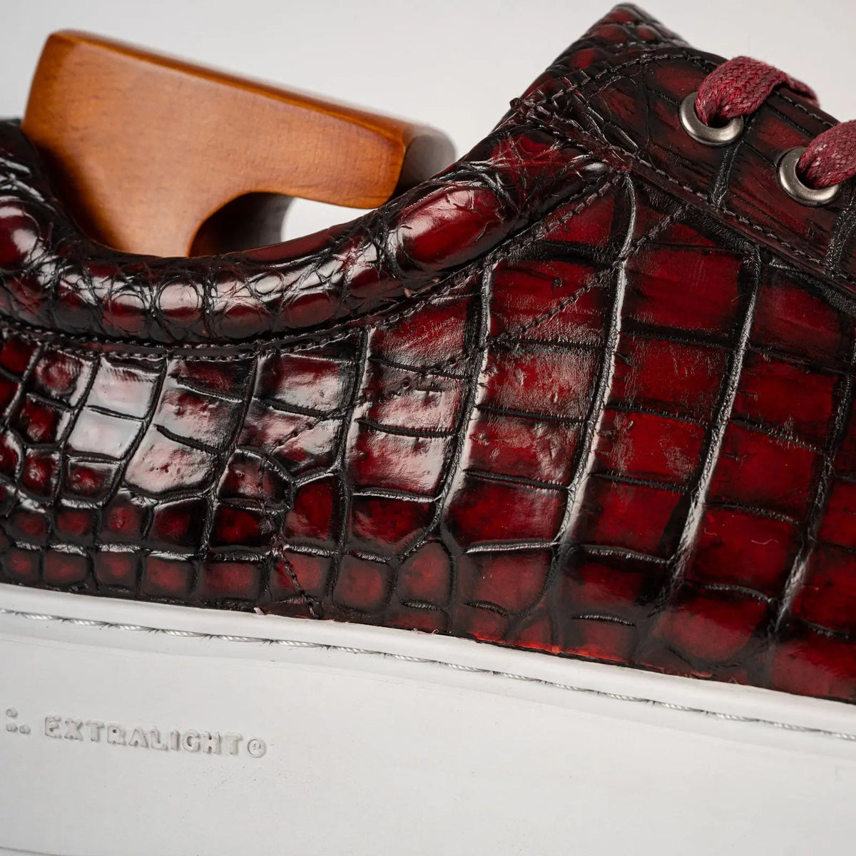 Burgundy and Black Glossy Textured Low-Top Sneaker