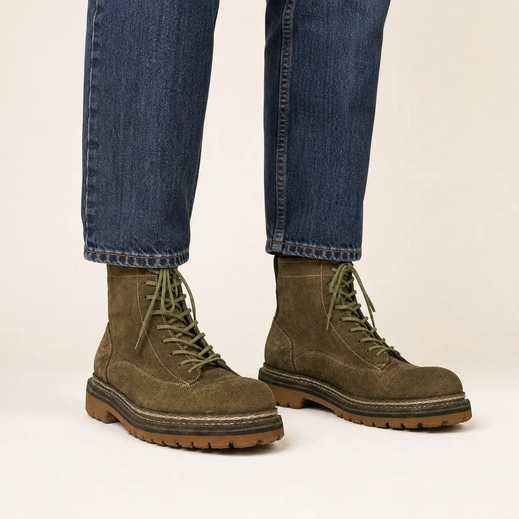 Olive suede combat boots with tan lug sole on-foot studio photo