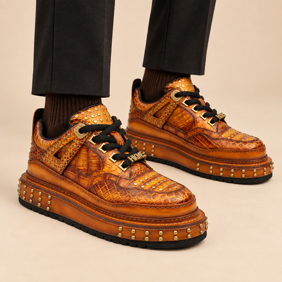 1002B amber yellow-orange studded textured platform sneaker — balanced on-foot hero